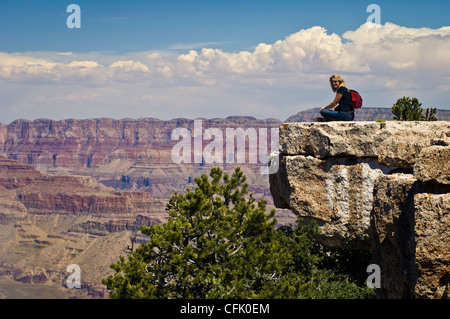 Woman visitor enjoying the view from Yaki Point on the South Rim of the Grand Canyon, Arizona. Stock Photo