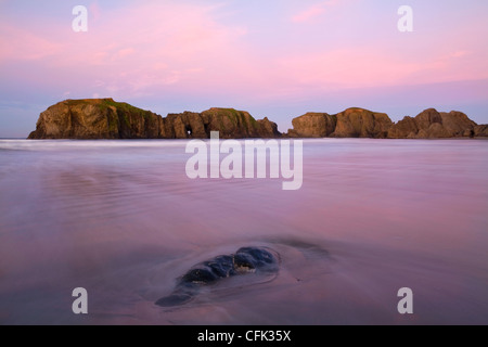 Bandon Beach arch and sea stacks at sunrise along the Oregon coast. USA Stock Photo