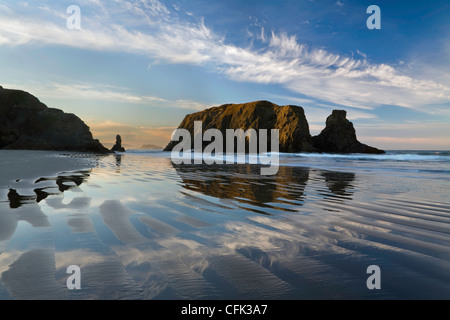 Tidepools and sea stacks at sunrise along Bandon Beach, Oregon. Winter. USA Stock Photo