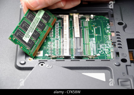 Installing new ram for your laptop Stock Photo