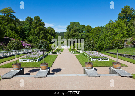Castle garden with flower beds and trees Stock Photo