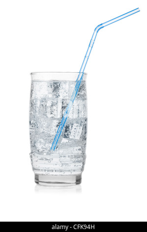 Glass of iced mineral water with straw isolated on white. Stock Photo