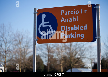 Bi-lingual disabled parking sign in Tesco extra supermarket car park, Newport, Wales, UK. Stock Photo