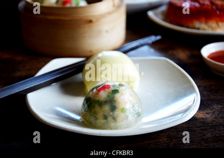 crystal chives dumpling and mini buns on dish Stock Photo