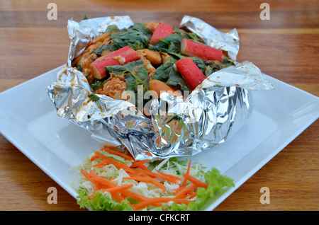 Ho Mok Thale is Thai food , curry seafood mixed herb served with vegetable Stock Photo