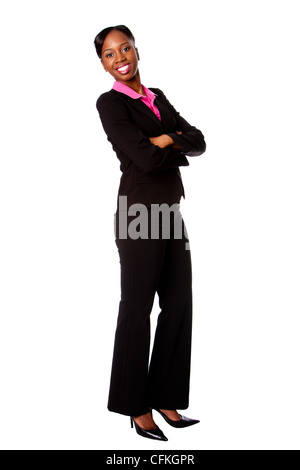 Beautiful happy smiling African corporate business student woman in suit standing with arms crossed, isolated. Stock Photo