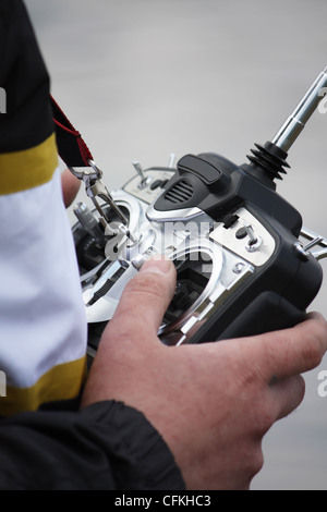 A man holding remote control in a hands Stock Photo