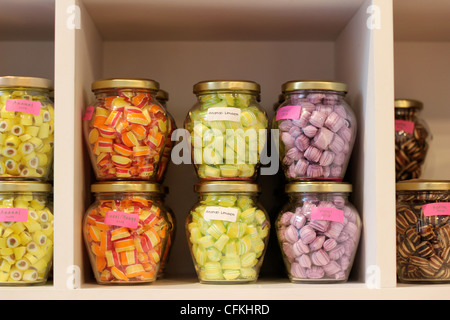 Jars of multi-coloured sweets on sale in a sweet shop in Bruges Stock Photo