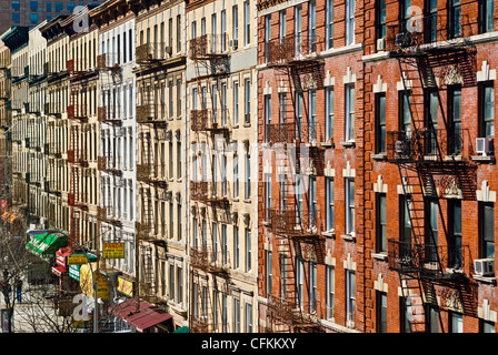 Fire escapes on tenement apartment buildings in Harlem neighborhood, New York City. Stock Photo