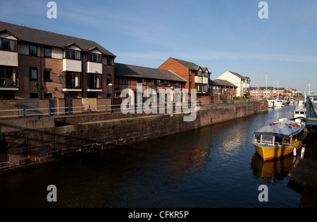 Moored Cardiff Bay water bus and residential properties at Penarth Marina, The Vale of Glamorgan, South Wales, UK Stock Photo