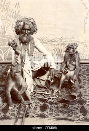 Indian Fakir & Pair of Trained Chimps Stock Photo