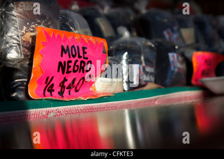 Traditional Mexican mole for sale in outdoor market. Stock Photo