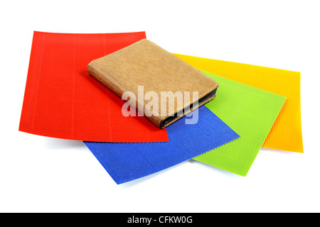 Notebook on sheets of the goffered cardboard isolated Stock Photo