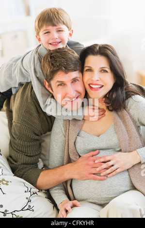 USA, New Jersey, Jersey City, Portrait of parents with son (4-5) on sofa Stock Photo