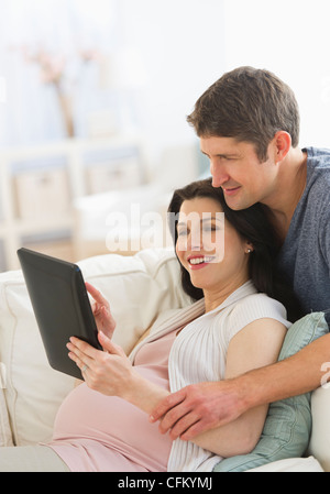 USA, New Jersey, Jersey City, Couple using tablet pc Stock Photo