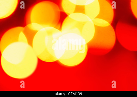 Glowing light on red background, studio shot Stock Photo