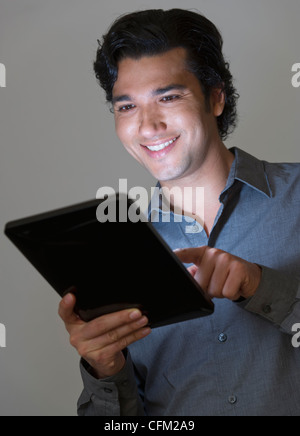 Studio shot of businessman using digital tablet Stock Photo