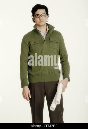 Studio shot of architect holding blueprint Stock Photo