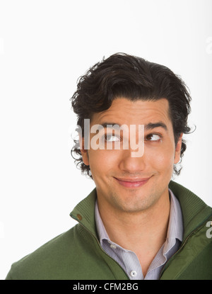 Studio shot of young man smiling Stock Photo
