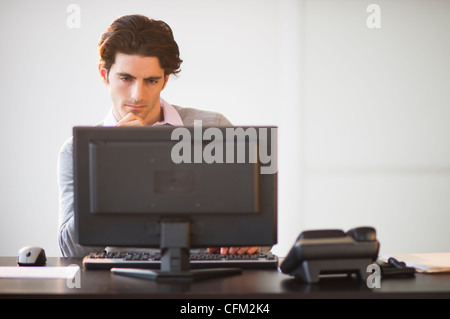 USA, New Jersey, Jersey City, Businessman working on computer Stock Photo