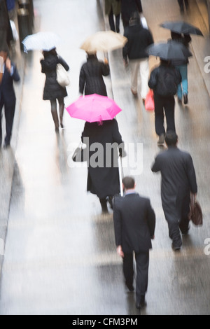 Pedestrians with umbrella Stock Photo - Alamy