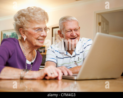 USA, Utah, Salt Lake City, Senior couple using laptop Stock Photo