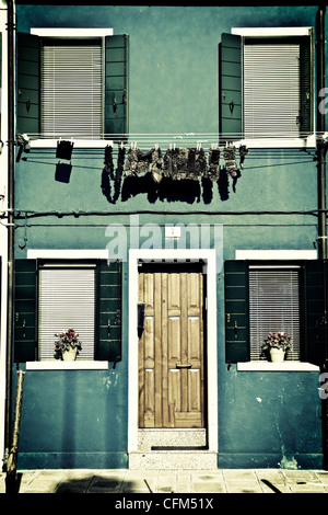 Clothesline in front of a house with rags in Burano, Venice, Italy Stock Photo