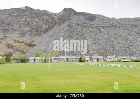 town landscape at Blaenau Ffestiniog, Wales with slate in the background and rugby posts Stock Photo
