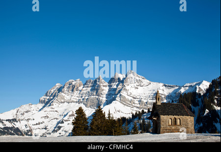 The small chapel of Les Crosets in front of the Dents du Midi. Switzerland. Stock Photo
