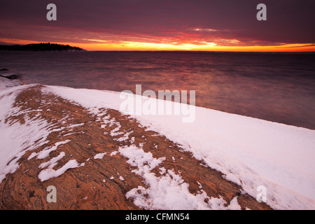 Coastal winter landscape at sunset, at Larkollen in Rygge kommune, Østfold fylke, Norway. Stock Photo