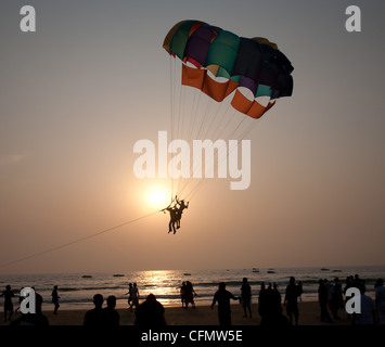 India Goa Colva beach tourists parasailing over the beach Stock Photo