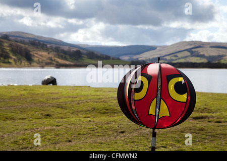 Bird Scarer and Coarse Fisherman on Lake Semerwater, North Yorkshire Dales and National Park, Wensleydale, UK Stock Photo