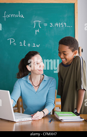 USA, California, Los Angeles, Teacher with schoolboy in classroom Stock Photo