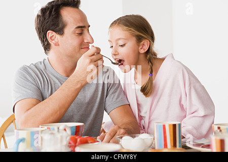 USA, California, Los Angeles, Father with daughter having breakfast Stock Photo