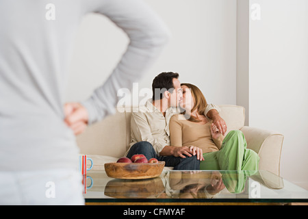 USA, California, Los Angeles, Couple kissing on sofa Stock Photo