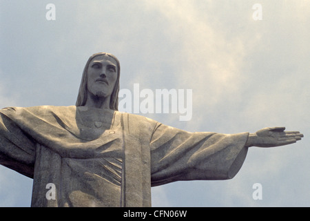 Christ the Redeemer statue of Jesus Christ rises above Rio de Janeiro Brazil atop Corcovado mountain Stock Photo