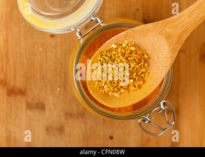 spice saffron and pepper in a wooden spoon, closeup Stock Photo