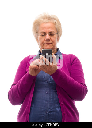 Happy mature woman using iPhone Stock Photo