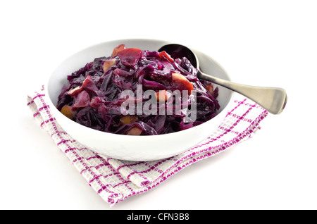 Warm and spicy red cabbage with apple in white dish on white background Stock Photo