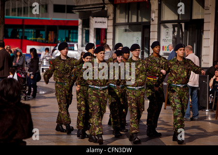 Troops from the Territorial Army regiment The Royal Yeomanry marching through the streets of Hammersmith Stock Photo