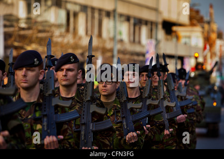 troops from the Territorial Army regiment The Royal Yeomanry marching through the streets of Hammersmith, london uk Stock Photo