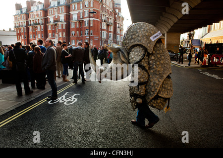 man dressed in rhino costume standing outside the Hammersmith Apollo Stock Photo