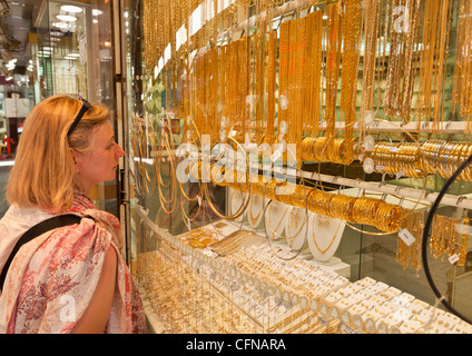 Female tourist shopping, Gold Souk Market, Deira, Dubai, United Arab Emirates, Middle East