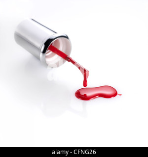 Red nail polish and colored brush Stock Photo