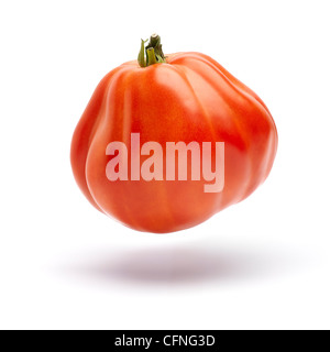 A beefsteak tomato floating on a white background. clipping path Stock Photo