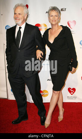 Pieter Jan Brugge and Jamie Lee Curtis 2011 MusiCares Person of the Year Tribute to Barbara Streisand held at the Los Angeles Convention Center Los Angeles, California - 11.02.11 Stock Photo