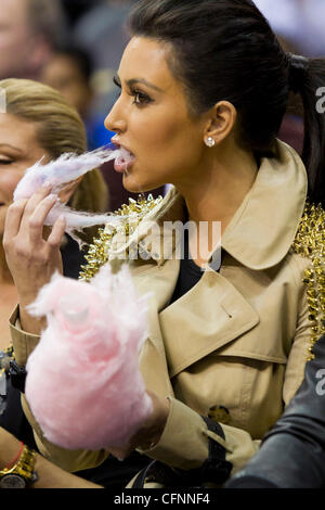 Kim Kardashian sits courtside during the NBA game between the New York Knicks and the New Jersey Nets at the Prudential Center in Newark New Jersey, USA - 12.02.11 Stock Photo