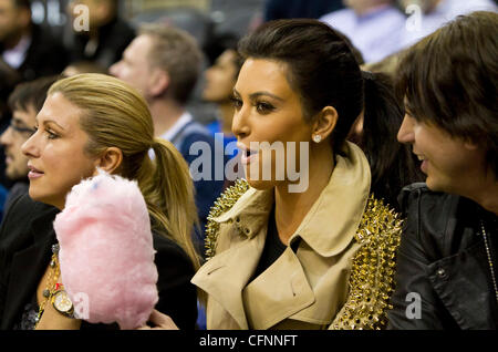 Kim Kardashian sits courtside during the NBA game between the New York Knicks and the New Jersey Nets at the Prudential Center in Newark New Jersey, USA - 12.02.11 Stock Photo