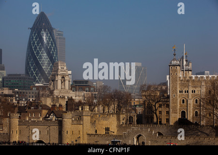 View of the Tower of London and the Gherkin on a misty morning in London Stock Photo