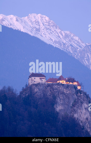 View across the beautiful Lake Bled, island church and hilltop castle when the lake was frozen over. Stock Photo